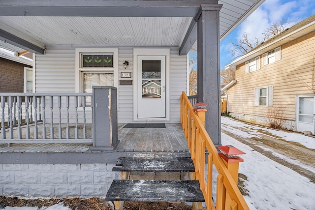 view of snow covered property entrance