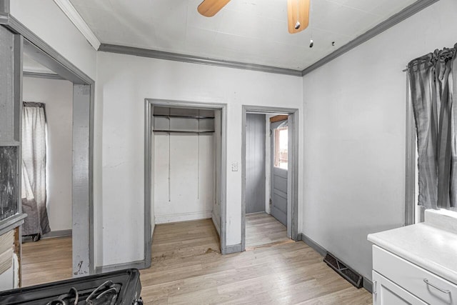 bedroom with ceiling fan, ornamental molding, and light hardwood / wood-style flooring