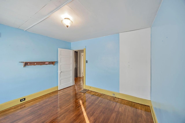 spare room with hardwood / wood-style flooring