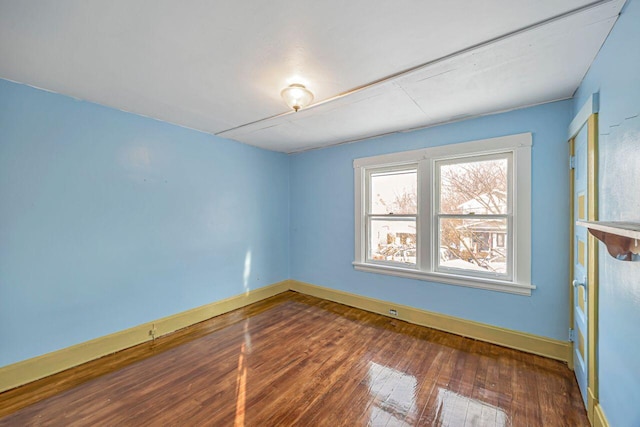 unfurnished room featuring dark hardwood / wood-style flooring