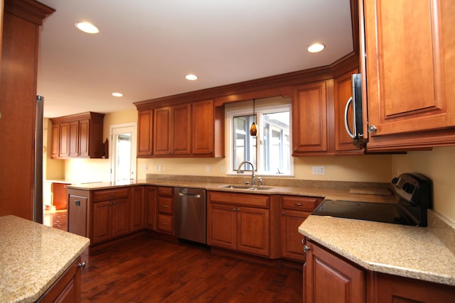 kitchen featuring stainless steel appliances, plenty of natural light, sink, and dark hardwood / wood-style flooring