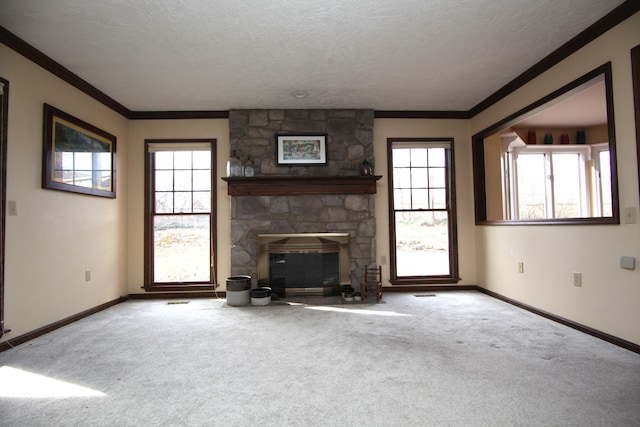 unfurnished living room featuring crown molding, a healthy amount of sunlight, carpet flooring, and a textured ceiling