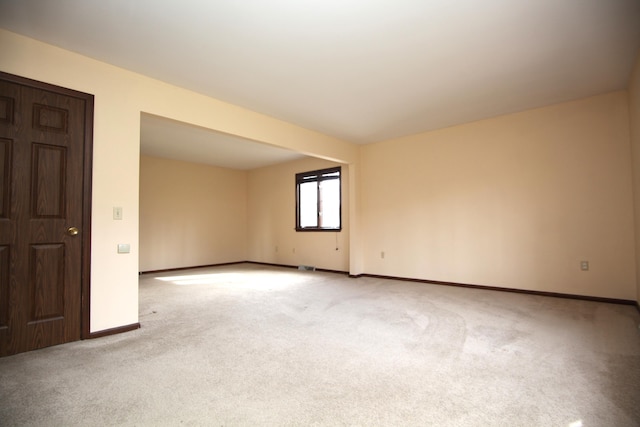 empty room featuring light carpet