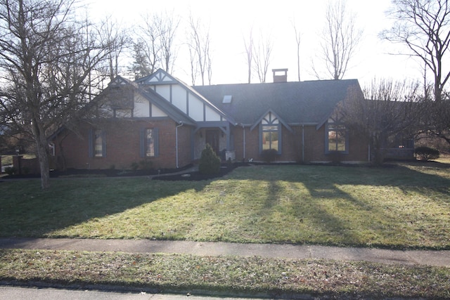 tudor house featuring a front lawn