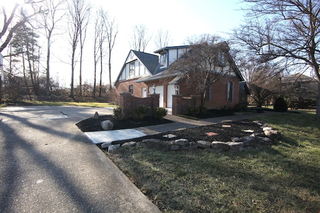 view of property exterior featuring a lawn