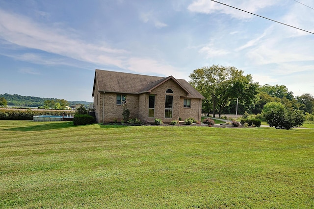 view of front of home with a front lawn