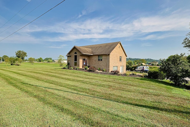 view of side of home featuring a lawn