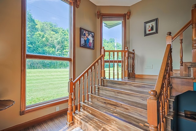 staircase featuring hardwood / wood-style flooring