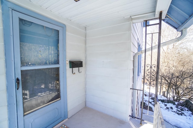 view of snow covered property entrance