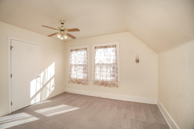 bonus room featuring ceiling fan, light colored carpet, and lofted ceiling