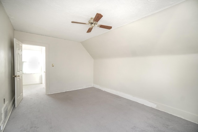 bonus room with vaulted ceiling and ceiling fan