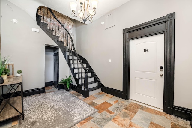 foyer with a notable chandelier