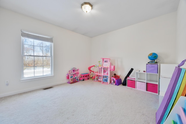 playroom with visible vents, baseboards, and carpet