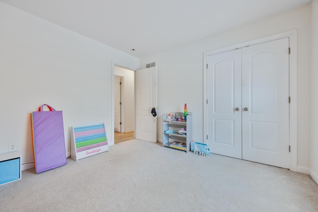 recreation room featuring visible vents, baseboards, and carpet