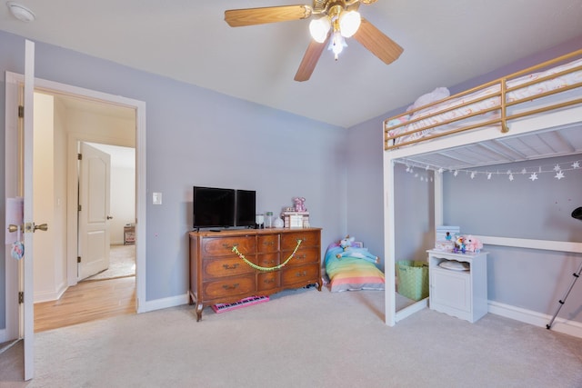 bedroom featuring baseboards, carpet floors, and ceiling fan