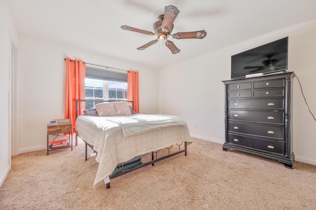 bedroom featuring carpet flooring, a ceiling fan, and baseboards