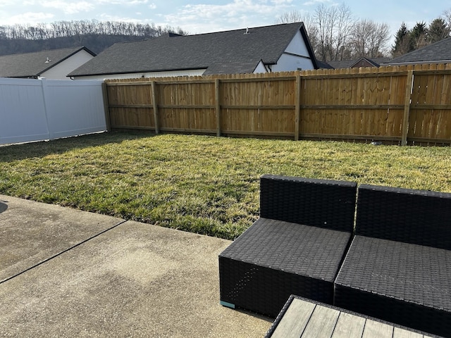 view of yard with a fenced backyard