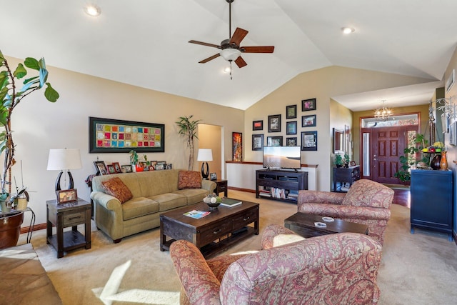 living room featuring ceiling fan with notable chandelier, lofted ceiling, and light colored carpet