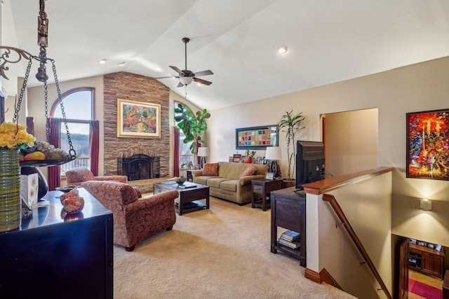 carpeted living room with ceiling fan, lofted ceiling, and a fireplace