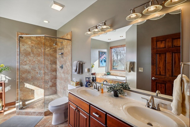 full bathroom featuring independent shower and bath, vanity, tile patterned flooring, and toilet