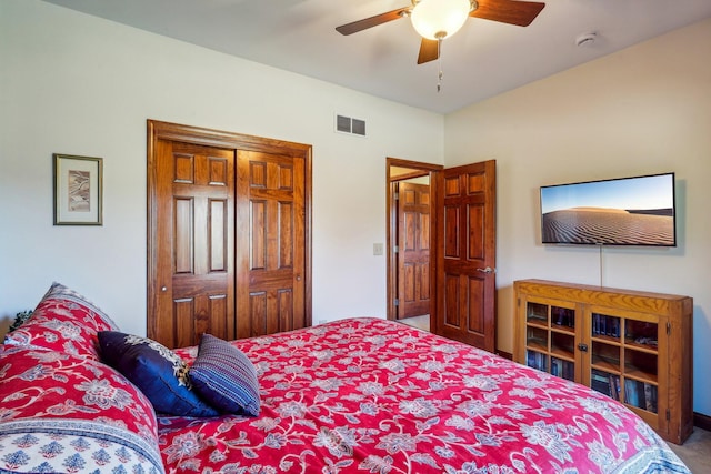 carpeted bedroom with a closet and ceiling fan