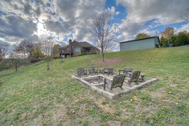 view of yard with an outdoor fire pit