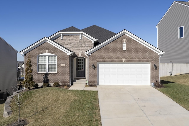 view of front of home featuring a garage and a front yard