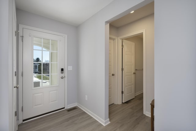 entryway with light hardwood / wood-style flooring