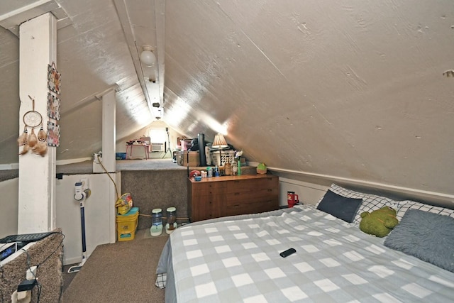 bedroom with lofted ceiling and carpet floors