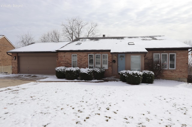 single story home with a garage