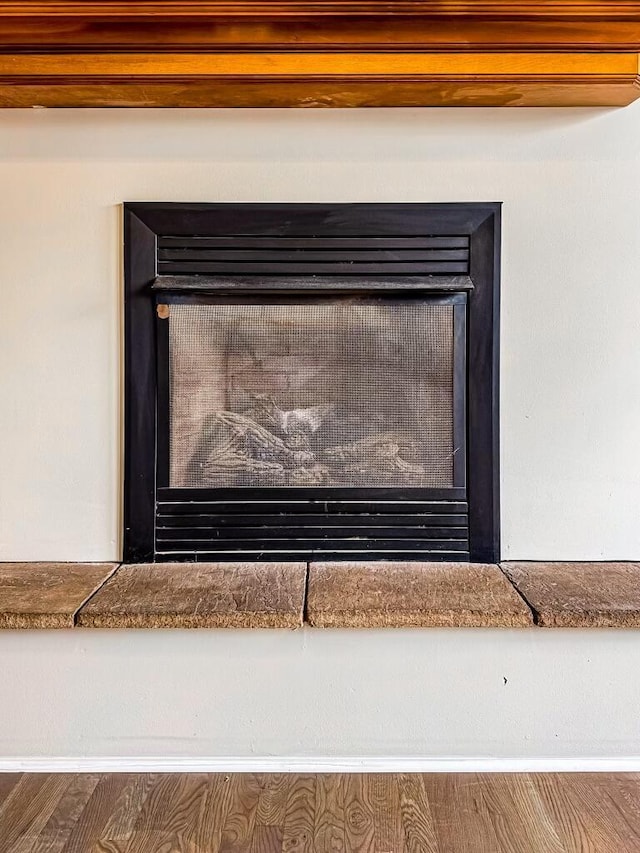 interior details with hardwood / wood-style flooring