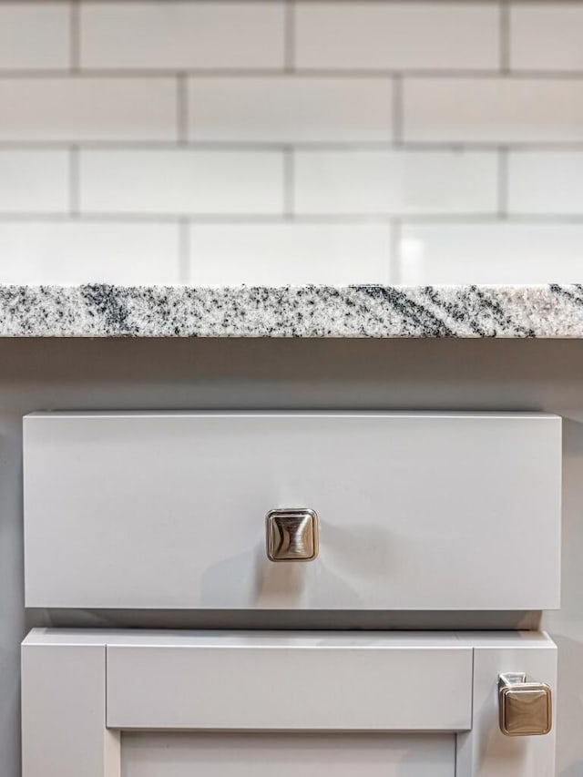 details featuring white cabinetry