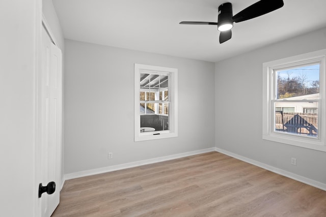 empty room featuring ceiling fan and light wood-type flooring