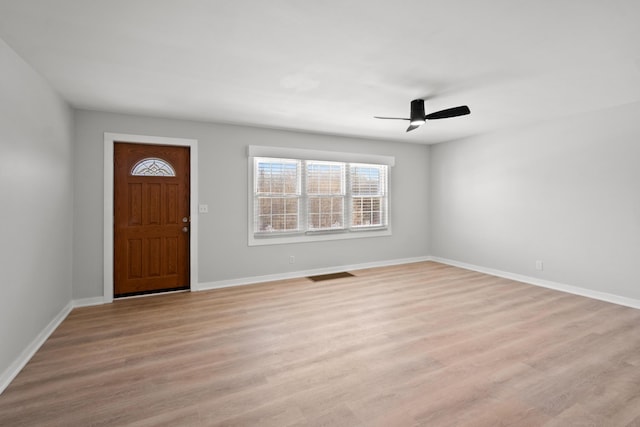 entryway with ceiling fan and light hardwood / wood-style flooring