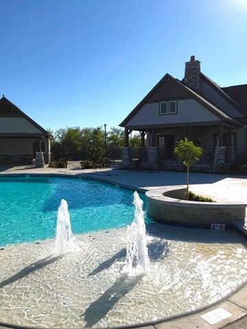 view of swimming pool featuring pool water feature