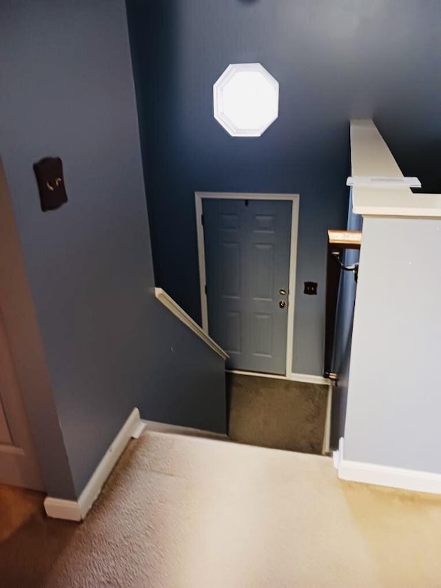 view of carpeted entrance foyer