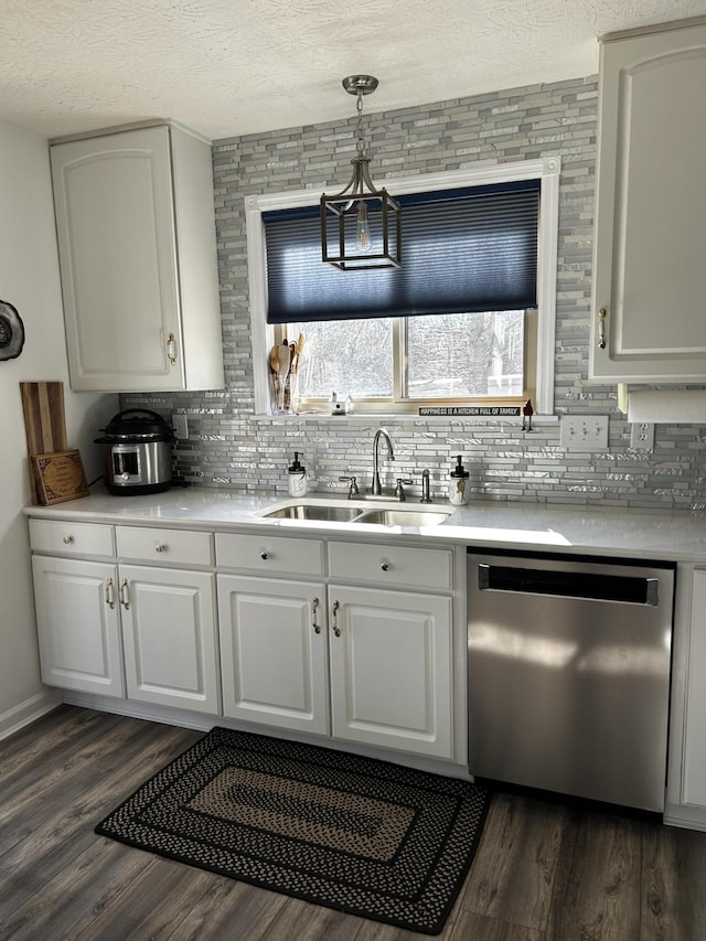 15027 Madison Pike, Morning View, KY 41063 - kitchen featuring stainless steel dishwasher, a sink, tasteful backsplash, dark wood-style floors, and a textured ceiling