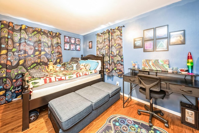 bedroom featuring wood-type flooring