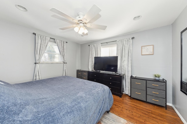 bedroom featuring dark wood-type flooring and ceiling fan