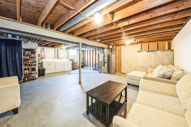 basement with gas water heater, heating unit, and independent washer and dryer