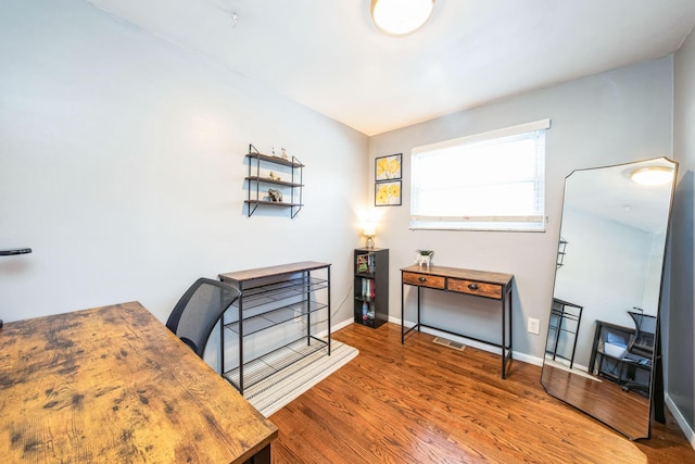 office area with wood-type flooring