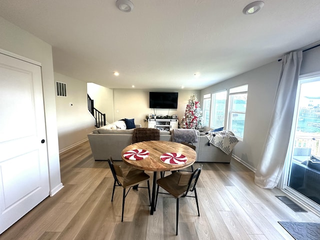 dining room with light hardwood / wood-style floors