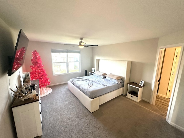 bedroom featuring ceiling fan and carpet flooring