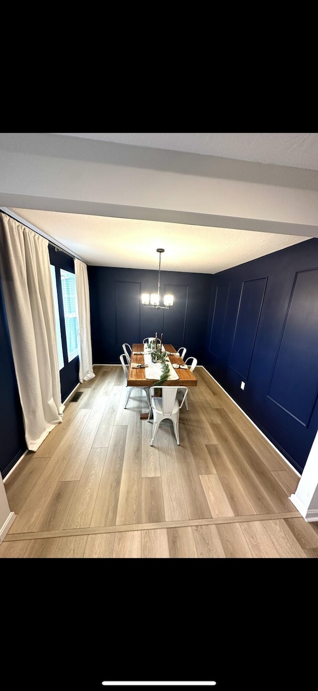 unfurnished dining area featuring light hardwood / wood-style floors