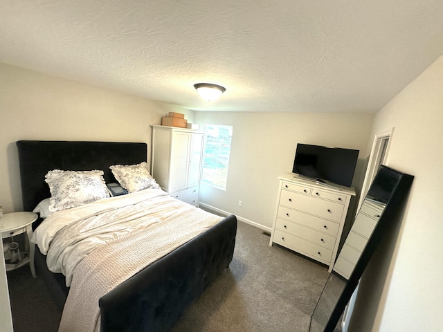 carpeted bedroom featuring a textured ceiling