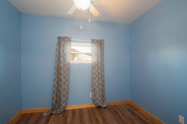 empty room featuring ceiling fan and wood-type flooring