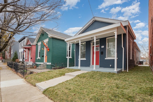 bungalow with a porch and a front yard