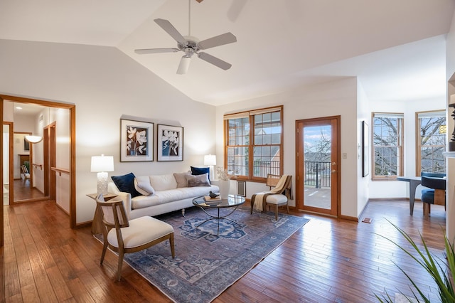 living room featuring dark wood-type flooring, ceiling fan, and lofted ceiling