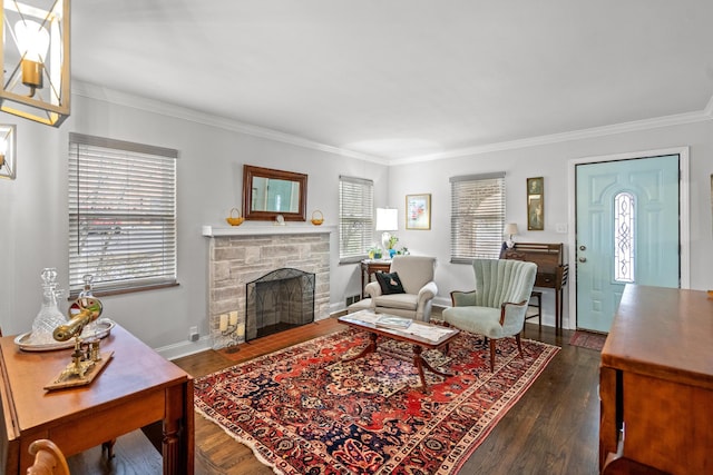 living room featuring crown molding, dark hardwood / wood-style flooring, and a stone fireplace