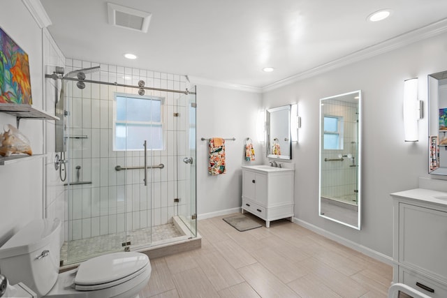 bathroom featuring vanity, walk in shower, crown molding, and toilet